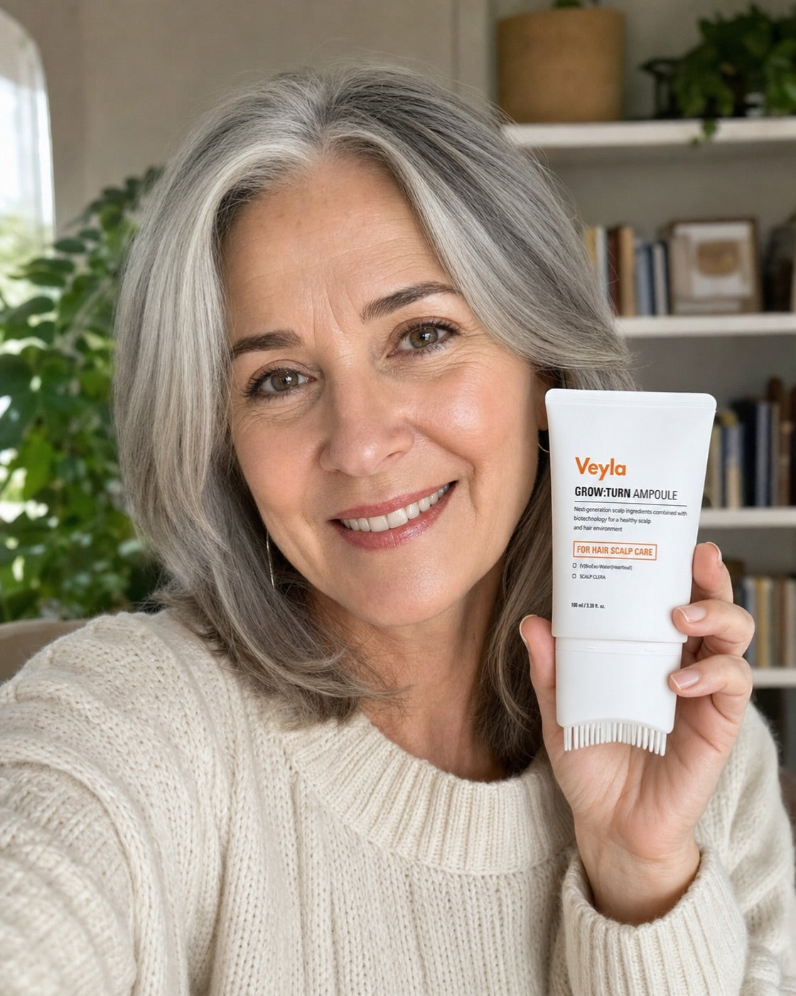 A customer holding the Veyla ampoule at home